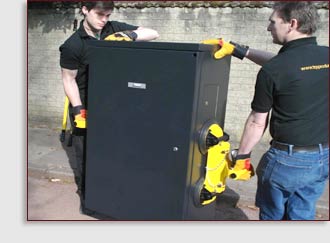 2 men using cabilft to lift traffic signal cabinet