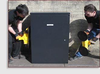 2 men using cabilft to lift traffic signal cabinet